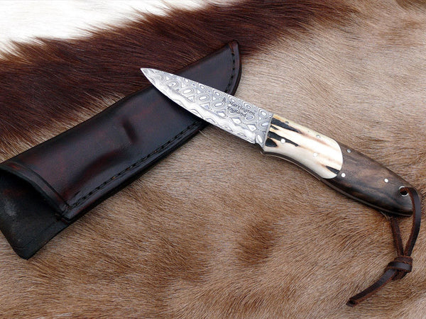 Bushcraft Knife in Hakapella Damasteel Walnut scales and Antler Bolsters